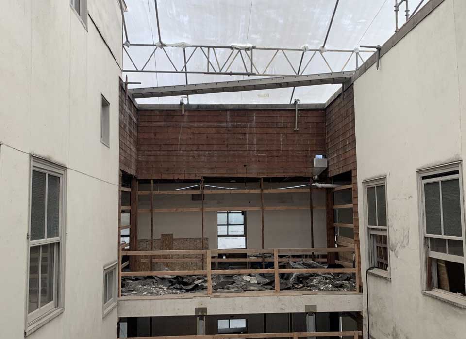 Henry Building | Removal of all flooring materials within 2nd floor through 6th floor, removal of concrete flooring in hallways, all kitchens throughout building. Ceiling, interior walls, and plumbing fixtures removal. Along with some salvaging.